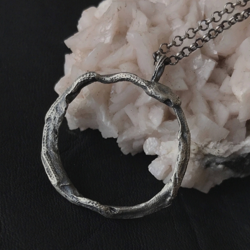 Uneven Creations Ourobouros circle serpent snake pendant